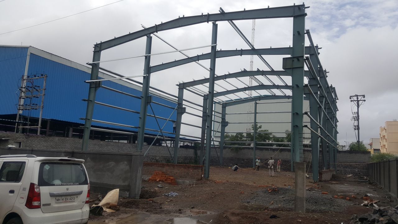 Warehouse steel structure under construction — Rajhans Industries